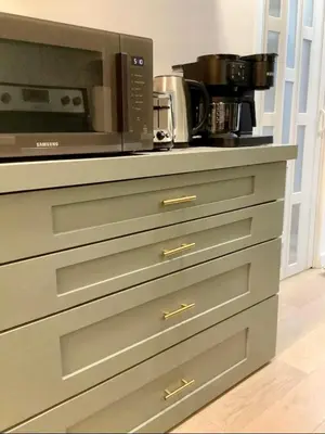 a microwave oven sitting on top of a kitchen counter at City Center Olive Grove in Kamloops