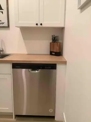 a kitchen with a dishwasher and a counter top at Sapphire Lux Queen Suite in Kamloops