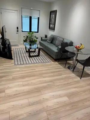 a living room with a couch and a table at Delux 2 bedroom suite in White Rock