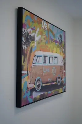 a painting of an old van in front of a wall at Center of the City in Vancouver