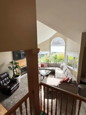 a living room with a couch and a table at The HI-Mark House - Hot tub,AC,Pool table, Pool May2026 in Sicamous
