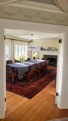 a dining room with a table and chairs at Shaughnessy Heritage Manor on Vancouver's Westside free housekeeping optional in Vancouver