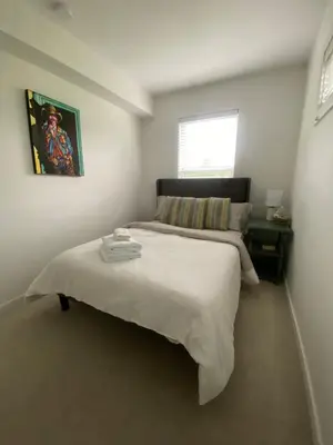 a bedroom with a large white bed in a room at Stylish Three Bedroom Townhome in Squamish