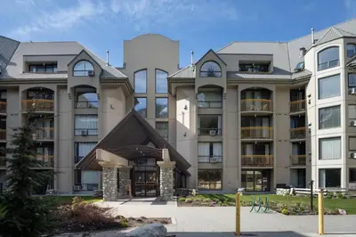 a large apartment building with a pointed roof at 1BR and Sofabed in Marquise, Near Ski Hill, Fireplace, Hot Tub and Sauna, Gym Access in Whistler