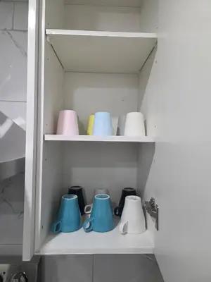 a cupboard with a bunch of pots and pans at Exclusive Suite in Edmonton in Edmonton