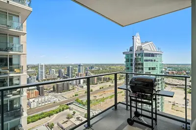 a view of a city from the balcony of a building at The Getaway Next to Stampede 2BR Suite Downtown in Calgary