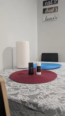 a table with two cups on top of it at Cozy Escape Guest Suite in Edmonton