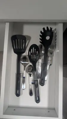 a drawer filled with spatulas and spoons at Cozy Escape Guest Suite in Edmonton
