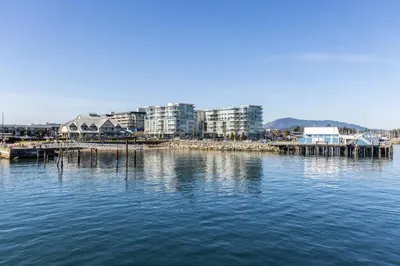 a view of a harbor with buildings and the water at Sidney Sunnyside - Luxurious Seaside Living in Amazing Sidney by Victoria Prime! in Sidney