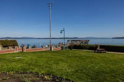 a park with a view of the water and a pier at Sidney Sunnyside - Luxurious Seaside Living in Amazing Sidney by Victoria Prime! in Sidney