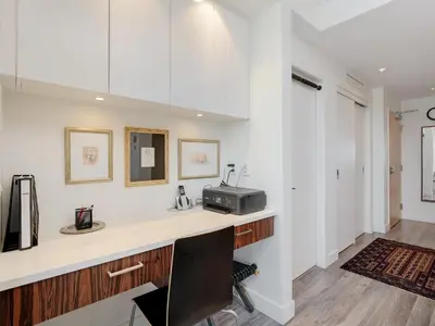 a kitchen with white walls and a counter with a toaster at Sunset Place-Deluxe One Bedroom Condo in the Escher Building, Sunset Views and Beyond in Victoria