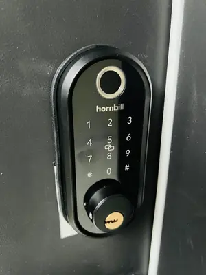 a close up of a remote control on a door at New and Modern 1 bedroom suite near beach in Surrey