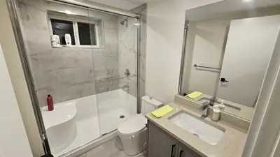 a bathroom with a tub and a sink and a shower at Your Home - Spacious Private Suite in Delta