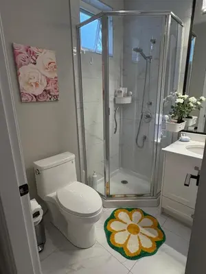 a bathroom with a shower and a toilet and a sink at Richmond home sweet home in Richmond
