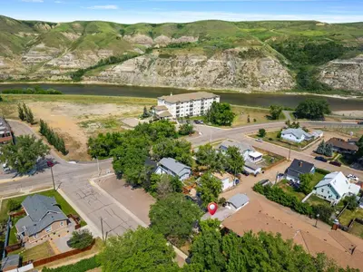 an aerial view of a small town with a river at The Canary 2BR Gem in Downtown Drumheller in Drumheller