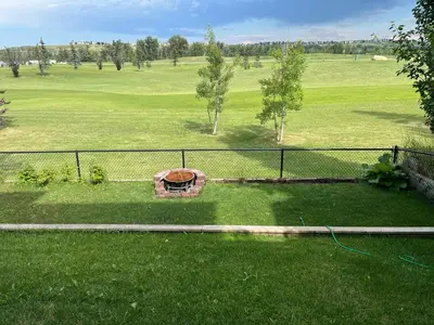 an aerial view of a field with a fence at The Flight Line in Calgary