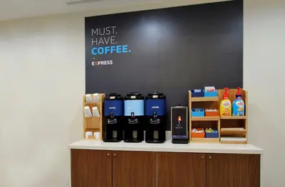 a counter with bottles of coffee on it at Holiday Inn Express & Suites Cold Lake by IHG in Cold Lake