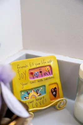 a toy skateboard sitting on a counter with writing on it at New 2BR Suite With Great Ocean View in West Vancouver in West Vancouver