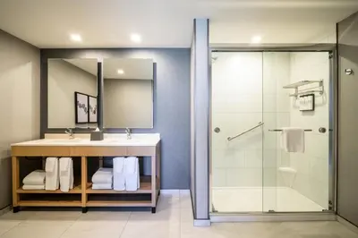 a bathroom with a sink and a shower at Hyatt Place Whitehorse in Whitehorse
