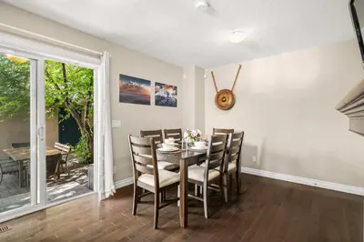 a dining room with a table and chairs at Social Haus Trendy 3BR Townhome in Bridgeland YYC in Calgary