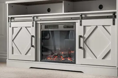 a fireplace with its doors open with a fire in it at Social Haus Trendy 3BR Townhome in Bridgeland YYC in Calgary