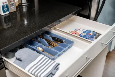 an open drawer in a kitchen with utensils at Spacious Downtown Condo with Pool Gym & Parking in Vancouver