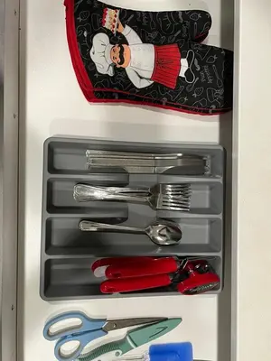 a drawer full of utensils in a refrigerator at single house in Edmonton