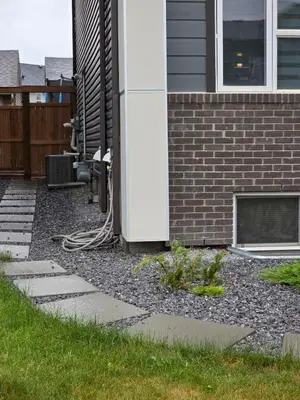 a backyard yard with a house with a fireplace at Haven YYC Guest Suite in Northwest Calgary in Calgary