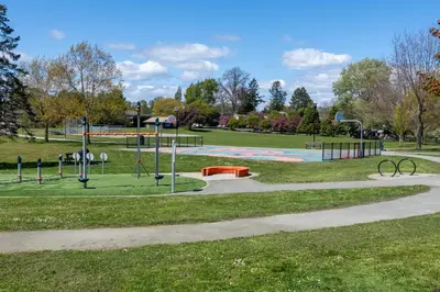 a park with a playground with a play area at Garden Cottage and Bunkie at Horner Park in Victoria