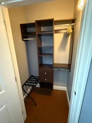 a closet with a dresser and shelves in it at Peaceful & Cozy Home with 3 rooms, SHARED Bathrooms and SHARED Common Space in Vancouver