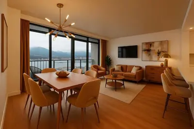 a living room with a table and chairs and a couch at The Ocean Crest in Vancouver
