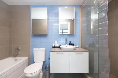 a bathroom with a toilet and a sink and a shower at The Ocean Crest in Vancouver