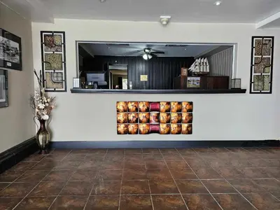 a store front with a display of apples on a wall at Marina Hotel in Port Alberni