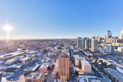 an aerial view of a city with tall buildings at City View 2 King Suites Floor-to-Ceiling Views in Calgary