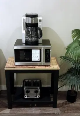 a coffee maker on top of a microwave on a table at Private & Beautifully Finished Suite, Windermere in Edmonton