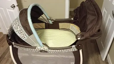an empty baby carriage sitting in a room at Beautifully Finished Basement Suite, Shared Entrance, SW Edmonton in Edmonton