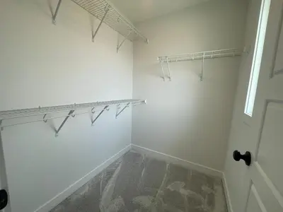 a room with white walls and a closet with hangers at Bedroom private Bathroom in Upland in Edmonton