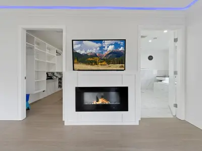 a living room with a fireplace and a tv at Spacious 4BR Langley Home in Langley