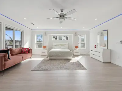 a living room with a bed and a couch at Spacious 4BR Langley Home in Langley