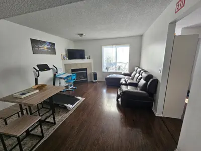 a living room with a couch and a table at Basement Appartment in Edmonton