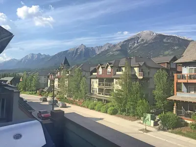 a view of a town with mountains in the background at Canmore Top Floor Loft-Style Retreat in Canmore