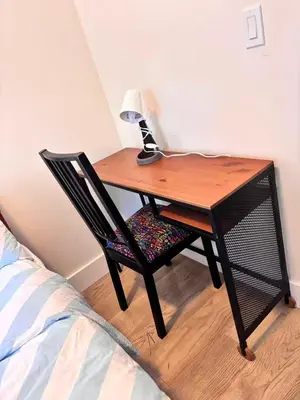 a desk with a chair with a lamp on top of it at Private Room in Vibrant Vancouver - with share living room and kitchen in Vancouver