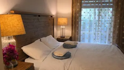 a bedroom with a bed with two towels on it at Private Room in Vibrant Vancouver - with share living room and kitchen in Vancouver