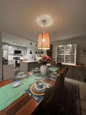a kitchen with a table with plates on it at LF Guesthouse in Nanaimo