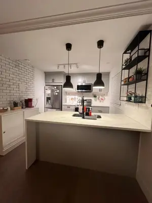 a kitchen with a white counter top in a room at LF Guesthouse in Nanaimo
