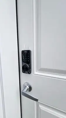 a door with a lock on a white door at Spruce Meadows Place in Calgary