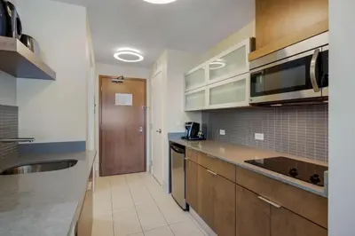 a kitchen with a sink and a counter top at Best Western Plus Sawridge Suites in Fort McMurray