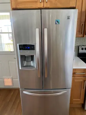 a kitchen with a stainless steel refrigerator with a microwave at Mountain View Villa with Saltwater Pool in Oliver