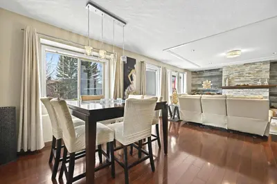 a dining room with a table and chairs at Calgary - By Mountains and Ski in Calgary
