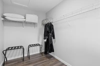 a room with two bunk beds and two chairs at Relax in Comfort, AC, YYC, CrossIron Mills, Banff in Calgary